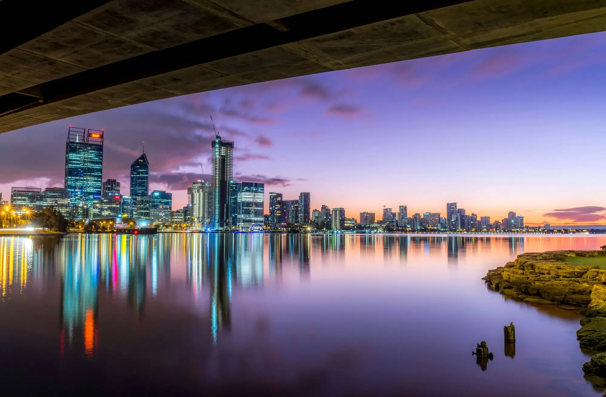 Perth city skyline across the Swan River at dusk